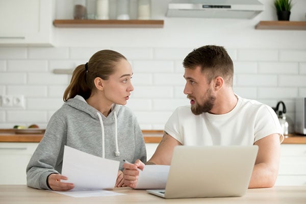 divorce couple looking at property division documents